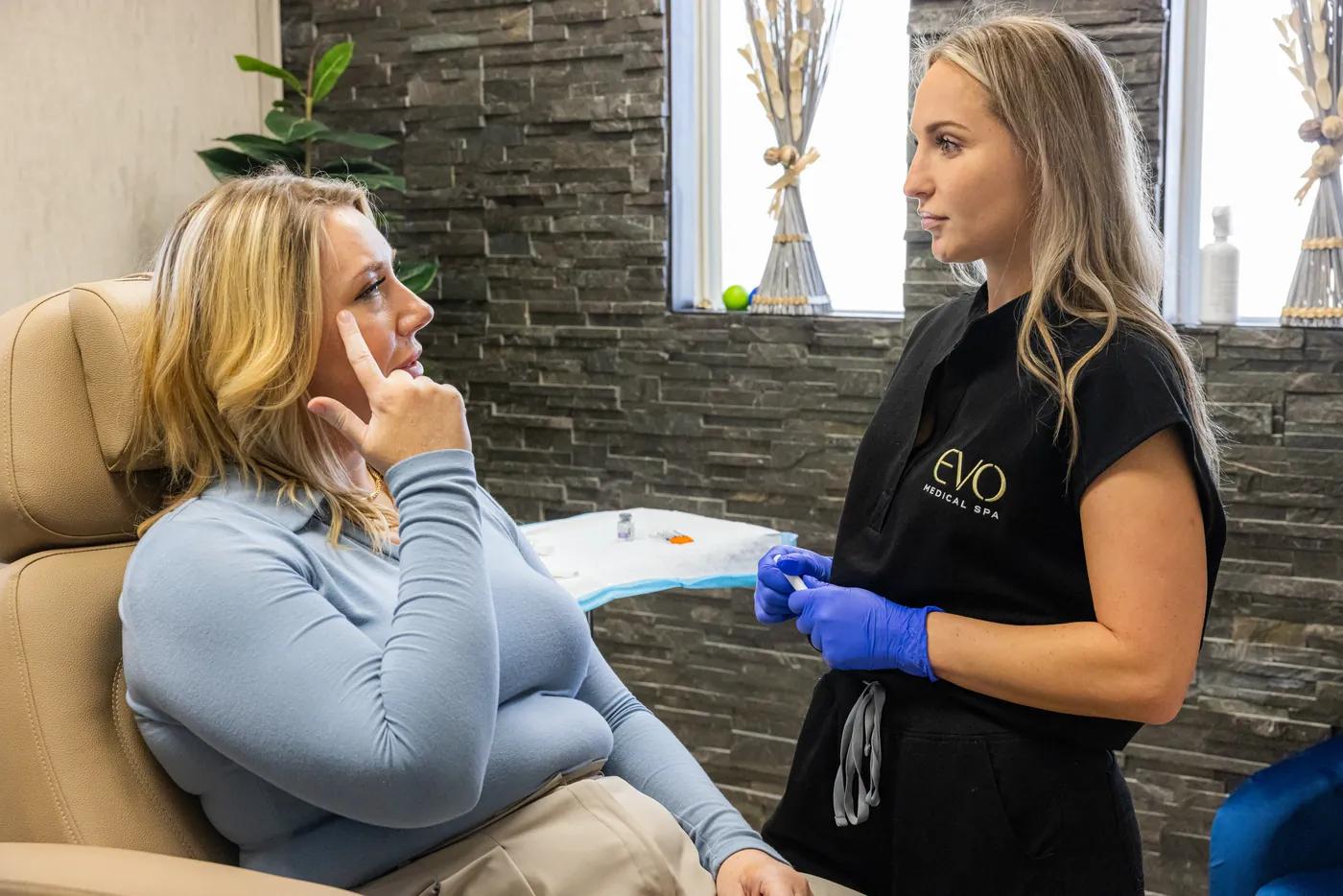 Injectable consultation against EVO's signature marble wall